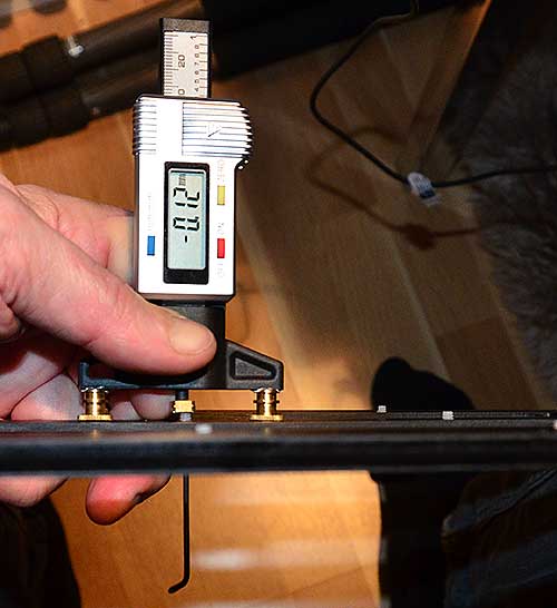 Height gauge used to adjust film holder for Epson scanner.